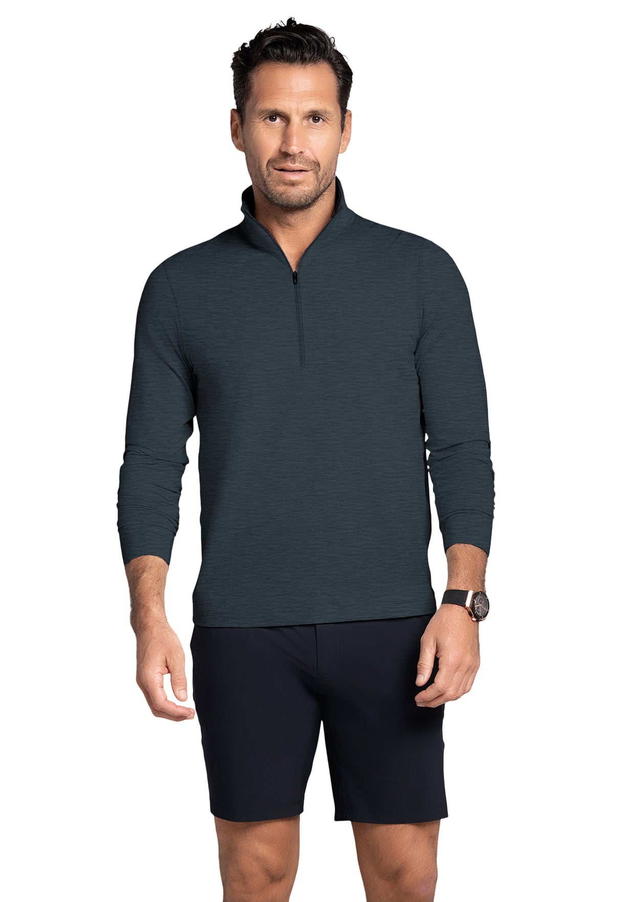 Man wearing a dark gray long-sleeve shirt and black shorts on a white background