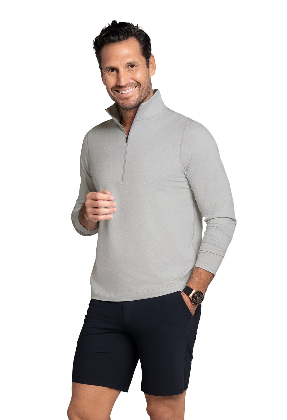 Man wearing a gray pullover and navy shorts on a white background