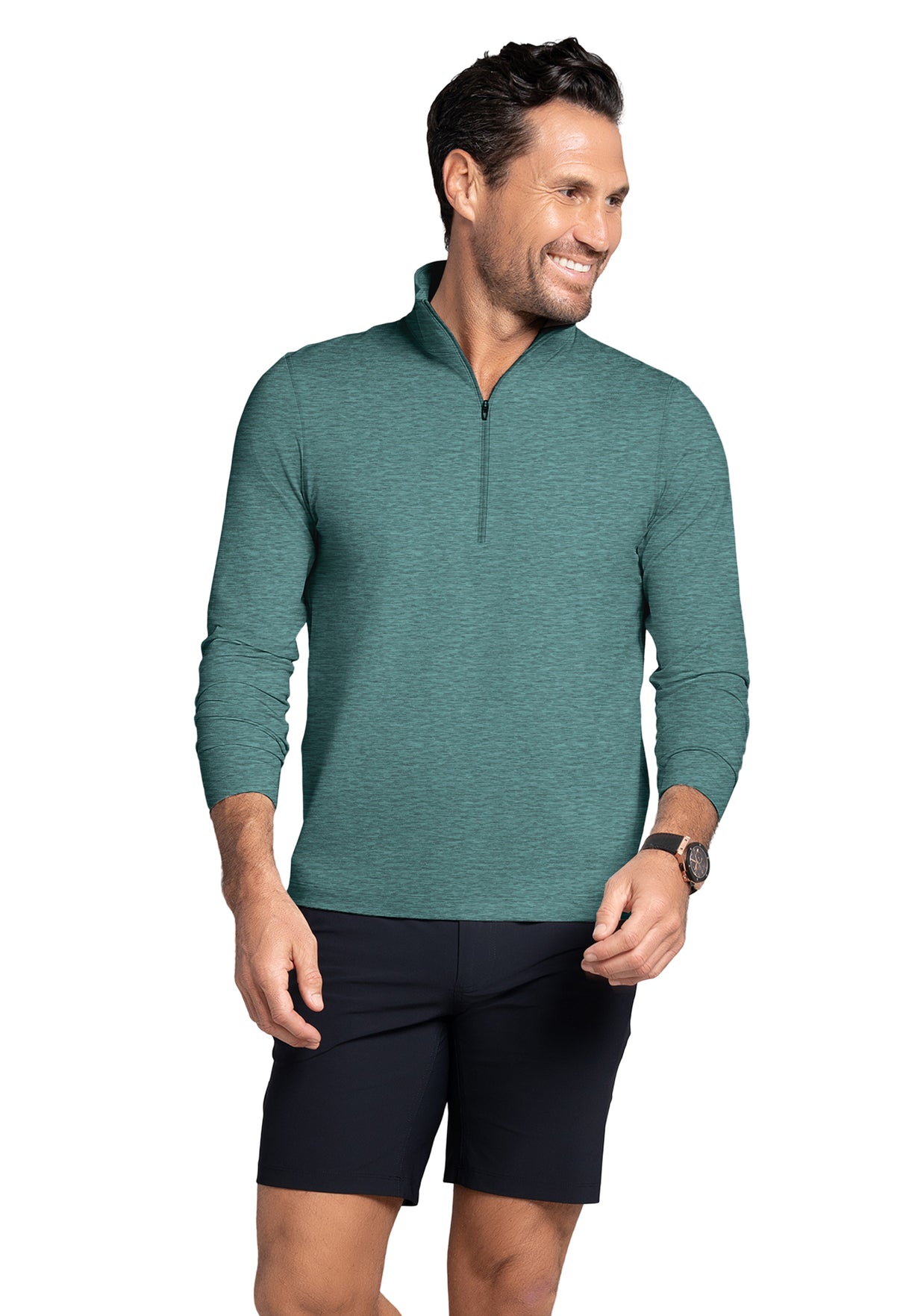 Man wearing a green quarter-zip sweater and black shorts on a white background